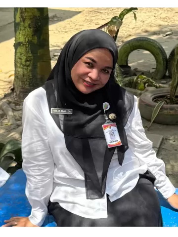 2. HELIA MALIZA, S.Pd., M.M.